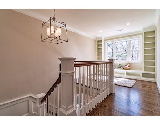 16 Woodcliffe Road Lexington, MA 02421 - Photo 13 of 30 a view of a hallway with wooden floor and chandelier