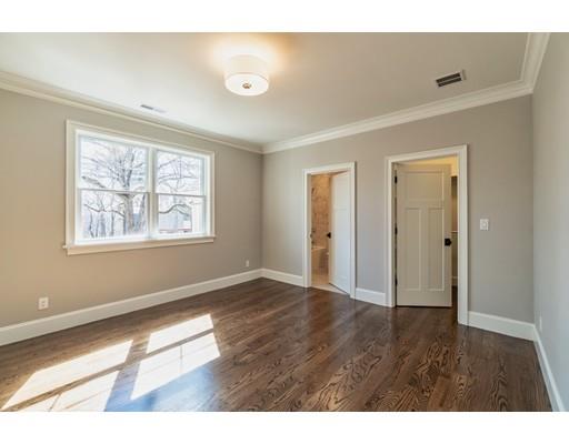 16 Woodcliffe Road Lexington, MA 02421 - Photo 21 of 30 a view of an empty room with wooden floor and a window