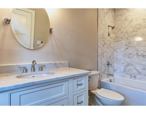 16 Woodcliffe Road Lexington, MA 02421 - Photo 22 of 30 a bathroom with a sink a toilet and a mirror