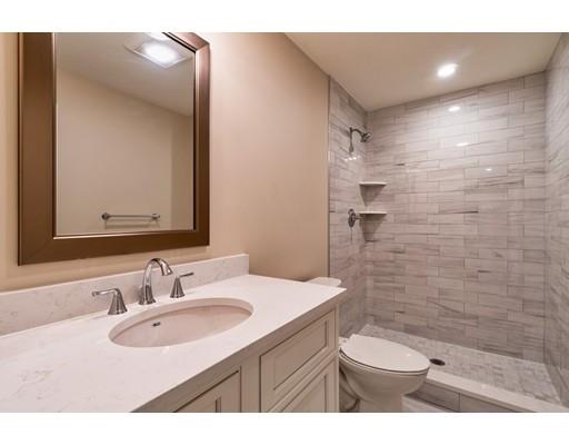 16 Woodcliffe Road Lexington, MA 02421 - Photo 24 of 30 a bathroom with a sink a toilet a mirror and shower