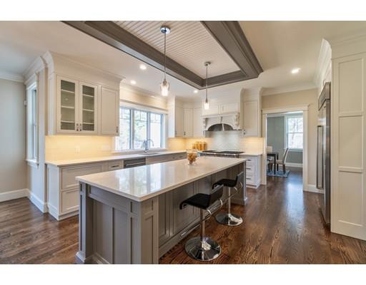 16 Woodcliffe Road Lexington, MA 02421 - Photo 3 of 30 a kitchen with a table chairs and wooden floor