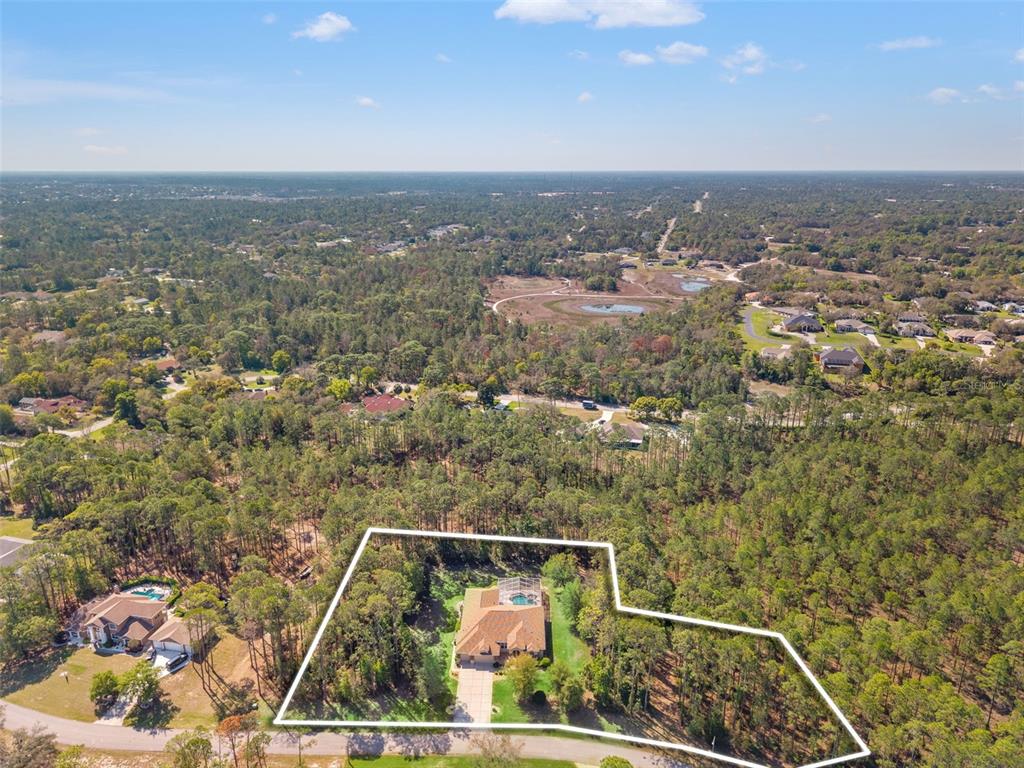 10260 Waters Edge Court Weeki Wachee, FL 34613 - Photo 3 of 58 an aerial view of a residential houses with city view