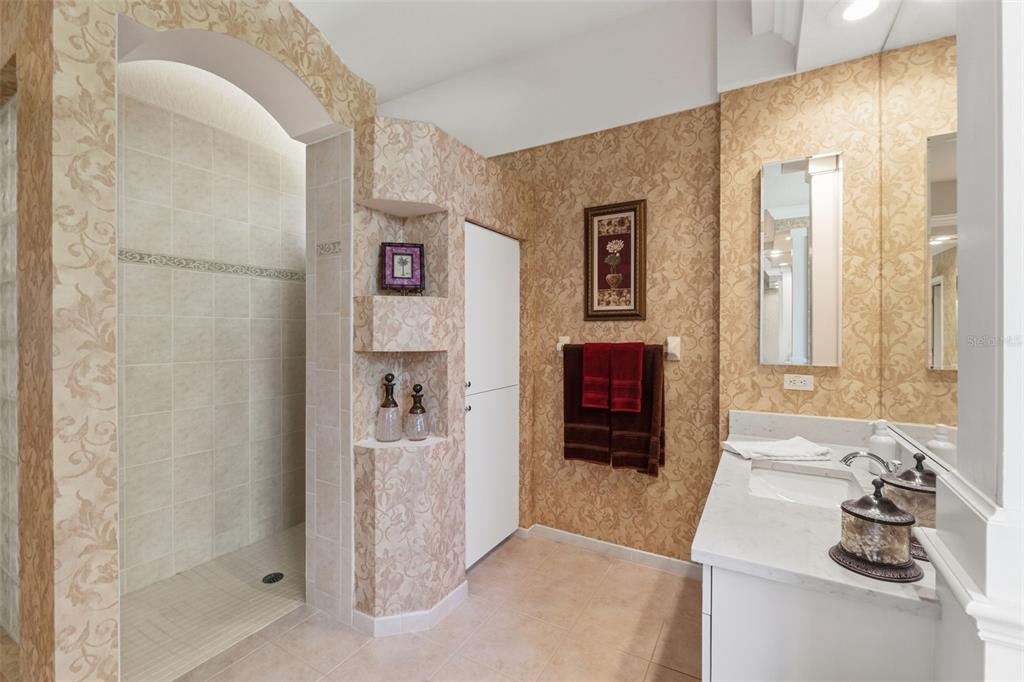 10260 Waters Edge Court Weeki Wachee, FL 34613 - Photo 34 of 58 a bathroom with a shower and a sink
