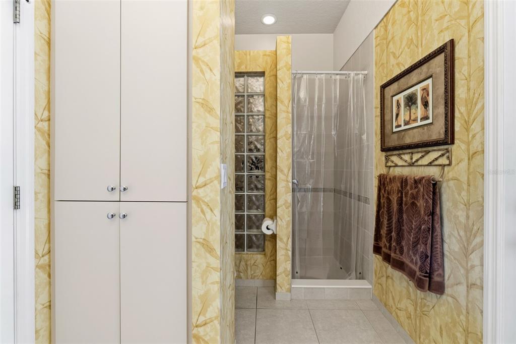 10260 Waters Edge Court Weeki Wachee, FL 34613 - Photo 39 of 58 a bathroom with a shower and a sink