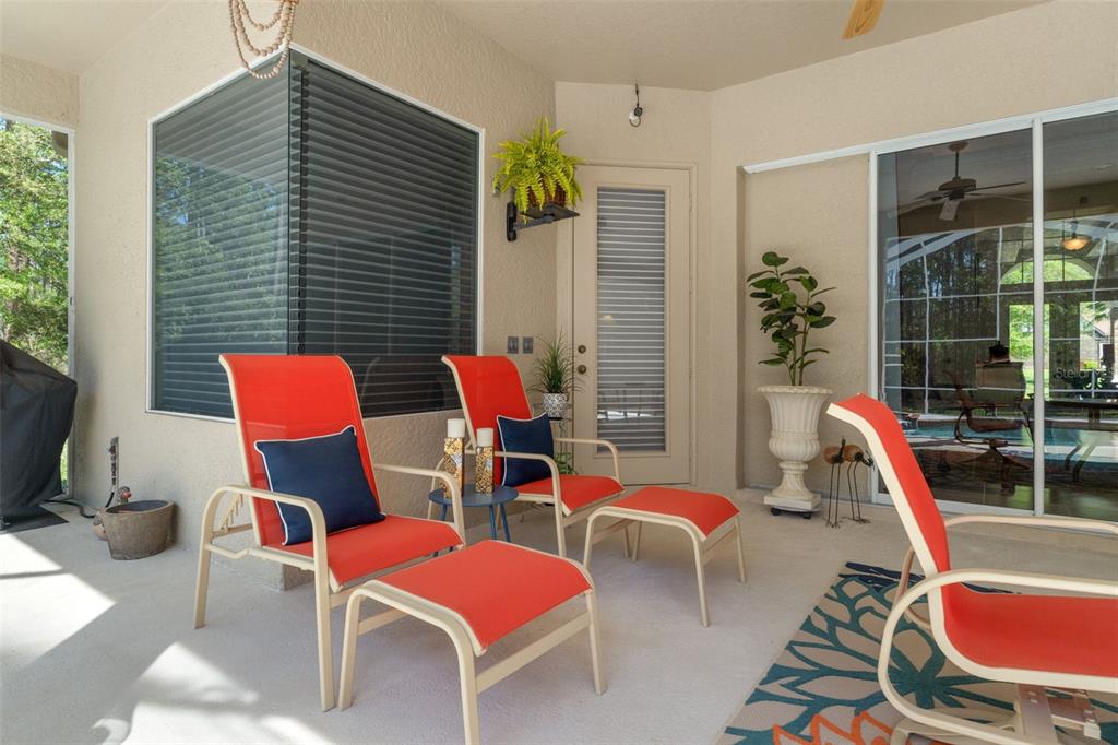 10260 Waters Edge Court Weeki Wachee, FL 34613 - Photo 46 of 58 a patio with a table and chairs