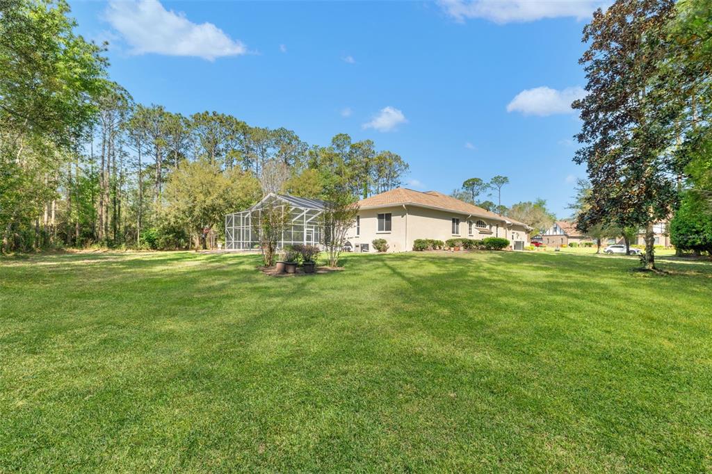 10260 Waters Edge Court Weeki Wachee, FL 34613 - Photo 53 of 58 a front view of a house with garden