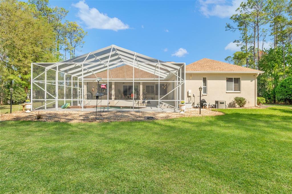 10260 Waters Edge Court Weeki Wachee, FL 34613 - Photo 54 of 58 a view of a house with a yard