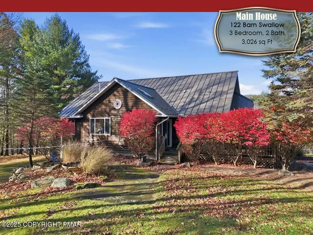 a view of a livingroom with furniture window and a fireplace