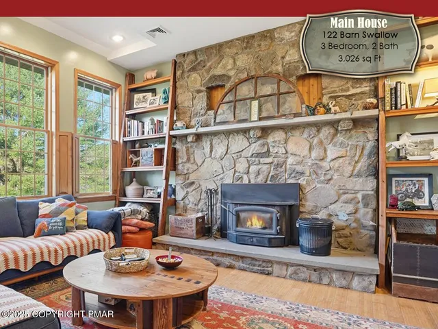 a kitchen with stainless steel appliances granite countertop a refrigerator a sink dishwasher a stove and white cabinets