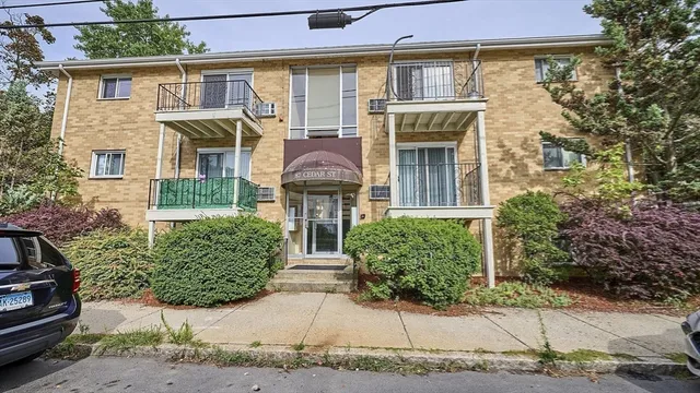 a view of a street with a building in the background