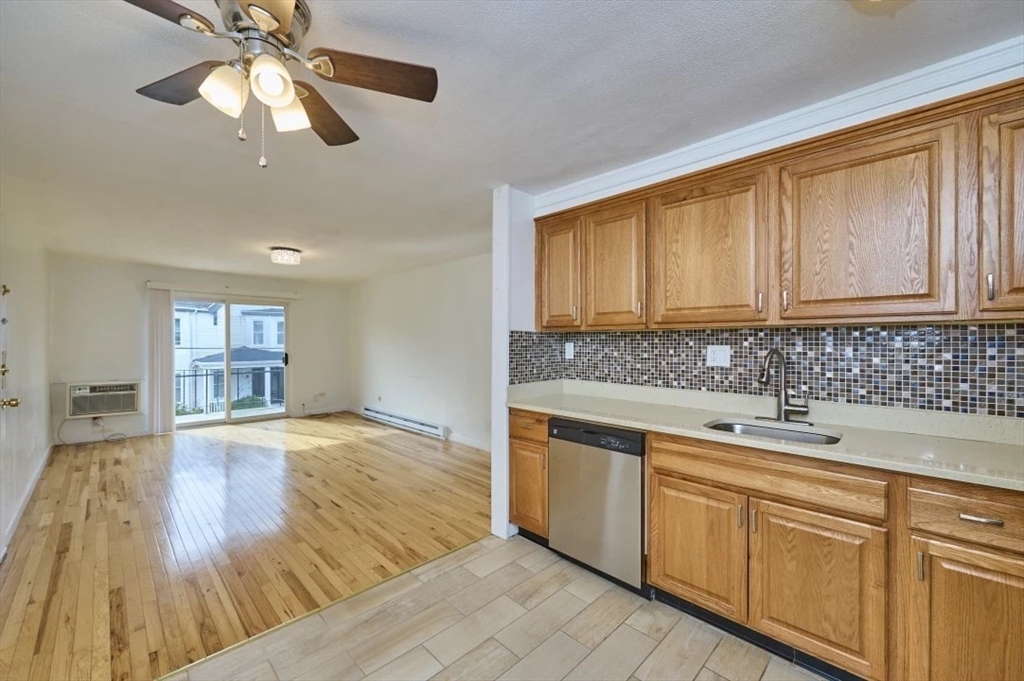 87 Cedar Street, Unit 10 Malden, MA 02148 - Photo 3 of 16 a kitchen with a sink cabinets and window