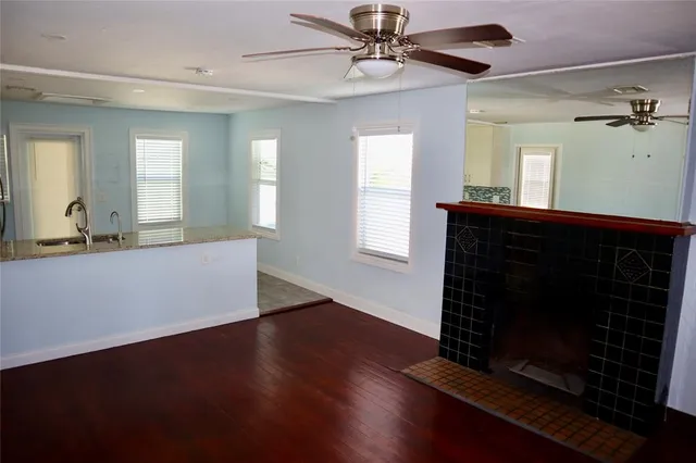 a living room with hard wood floors