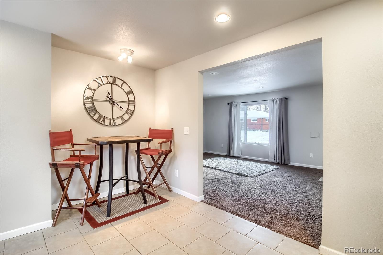 7545 Turner Drive Denver, CO 80221 - Photo 11 of 38 a view of a hallway with a table and a mirror
