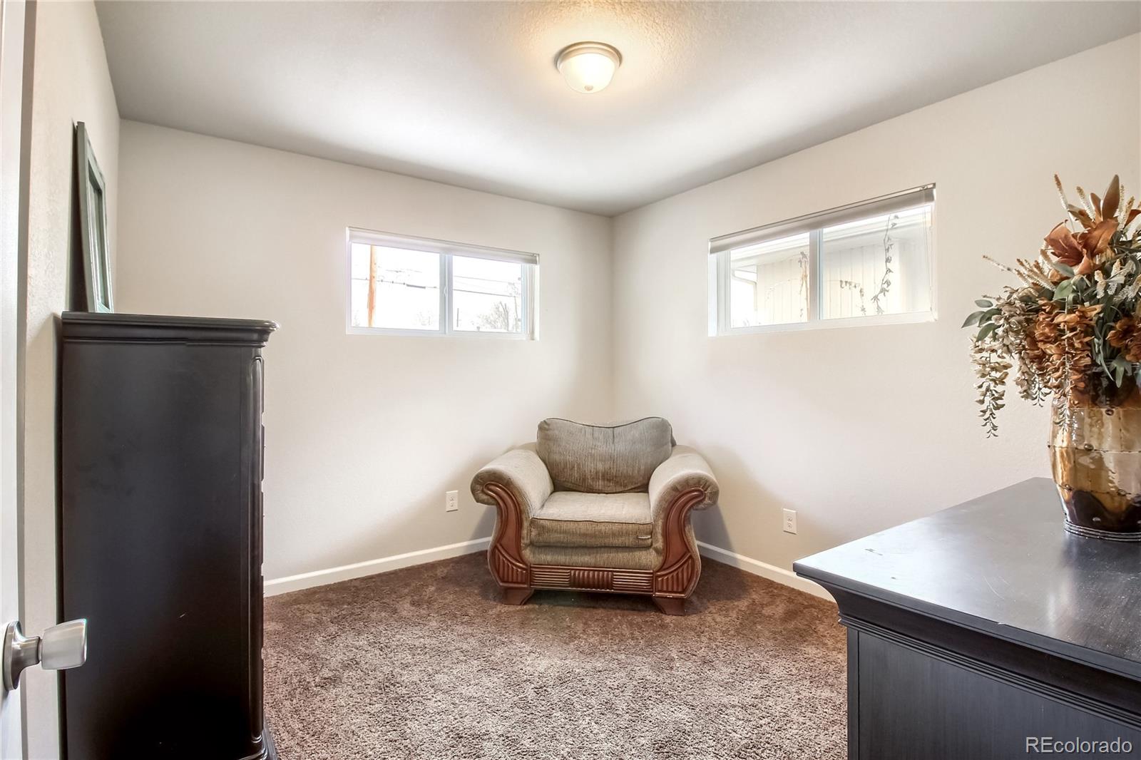 7545 Turner Drive Denver, CO 80221 - Photo 17 of 38 a living room with furniture and potted plant