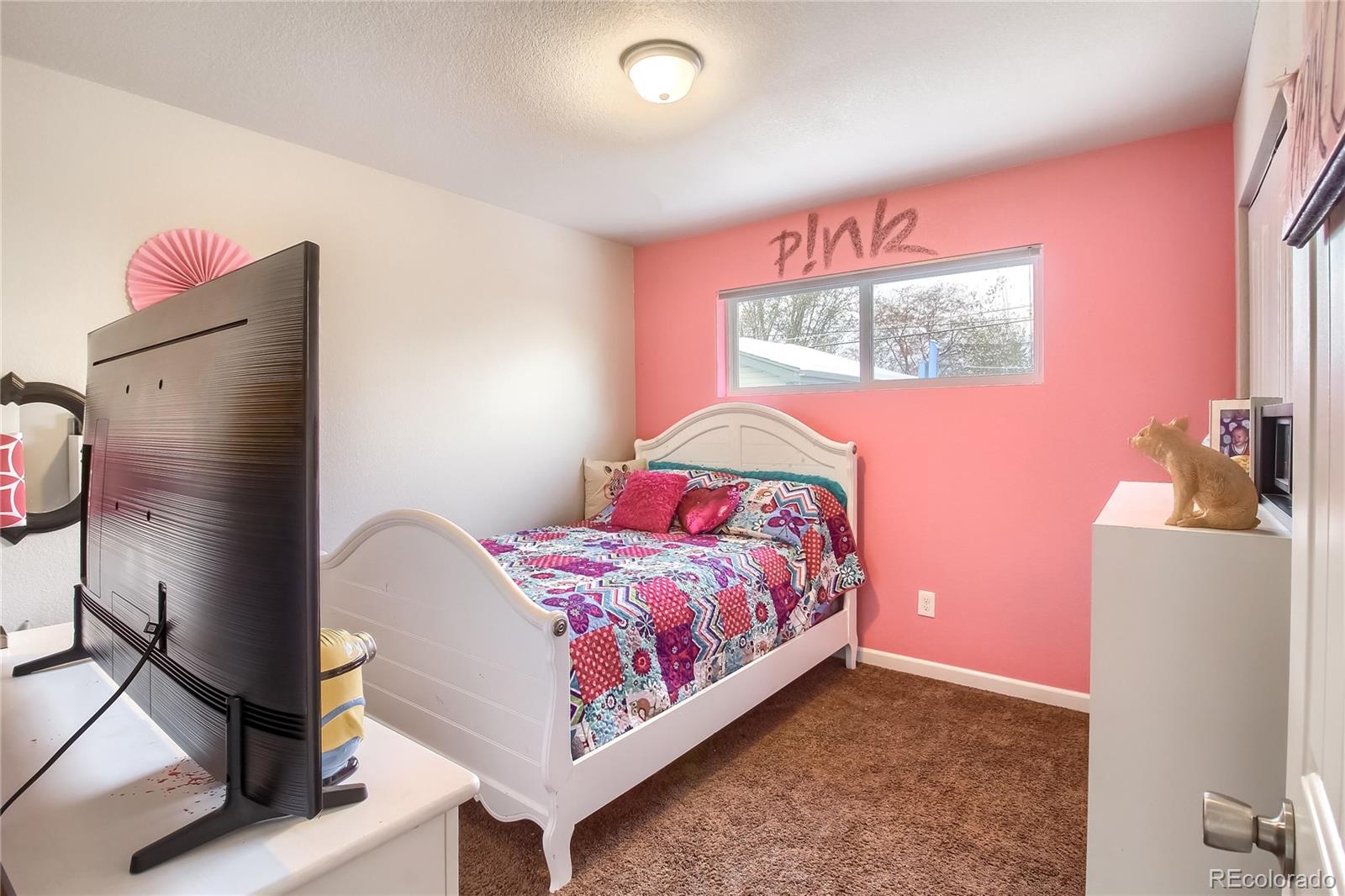 7545 Turner Drive Denver, CO 80221 - Photo 20 of 38 a bedroom with a bed dresser and a window