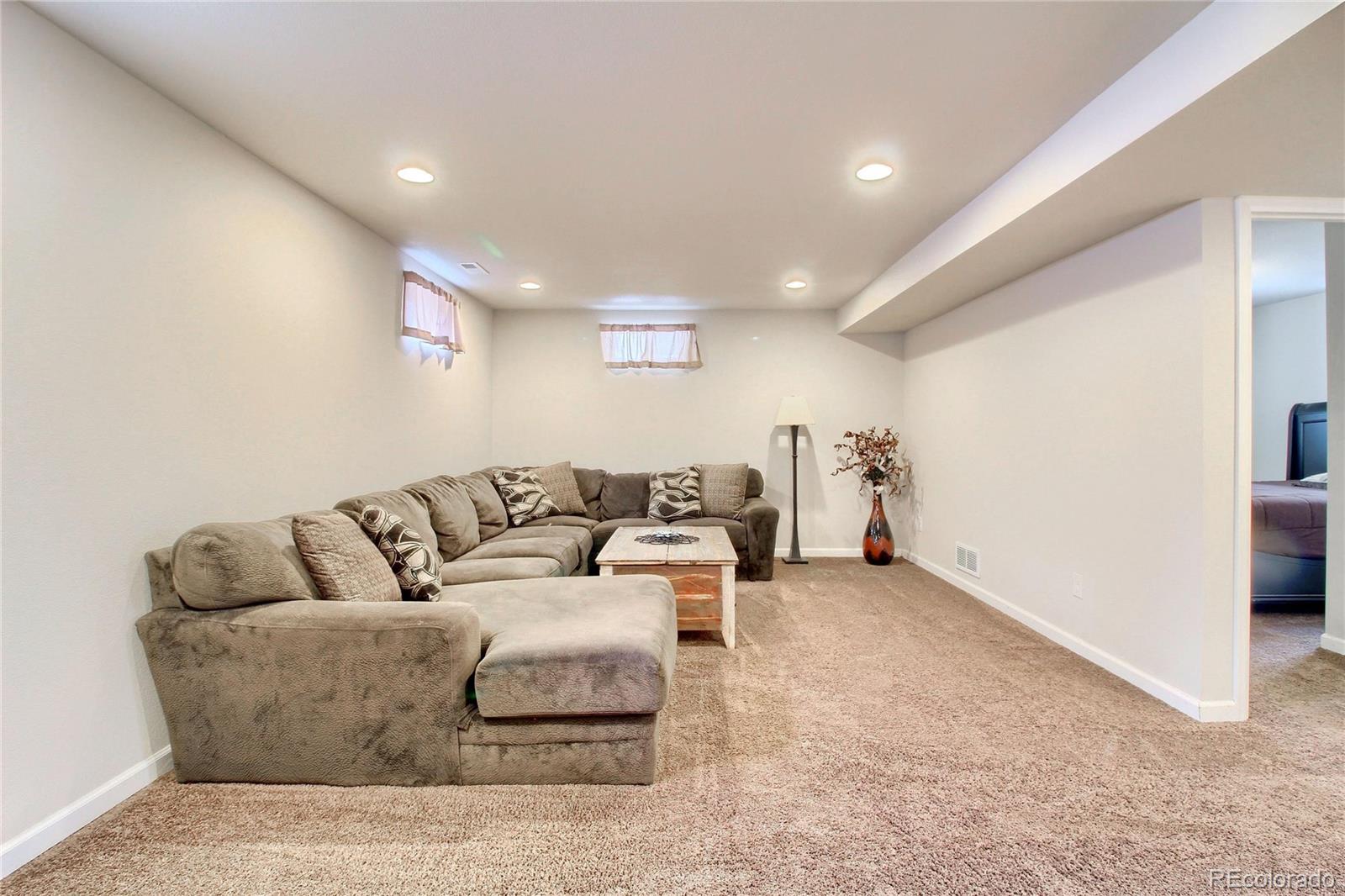 7545 Turner Drive Denver, CO 80221 - Photo 27 of 38 a living room with furniture and a couch