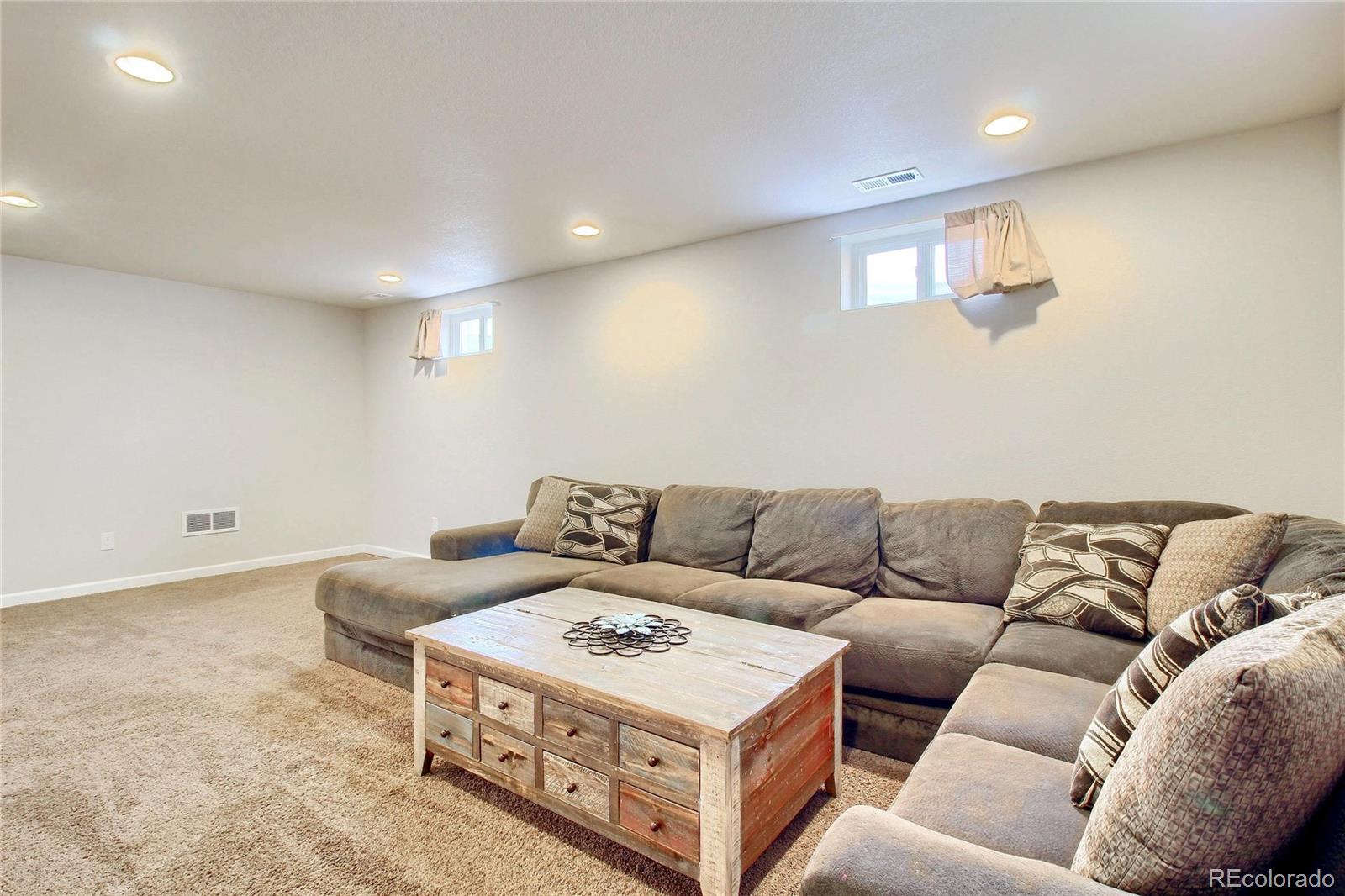 7545 Turner Drive Denver, CO 80221 - Photo 29 of 38 a living room with furniture and a couch