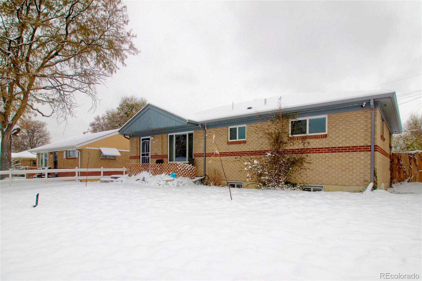 7545 Turner Drive Denver, CO 80221 - Photo 3 of 38 an outdoor view of a house with a patio