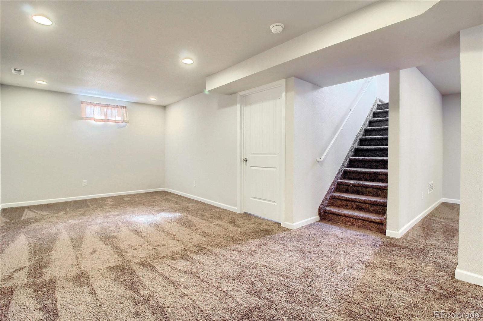 7545 Turner Drive Denver, CO 80221 - Photo 31 of 38 an empty room with windows and entryway