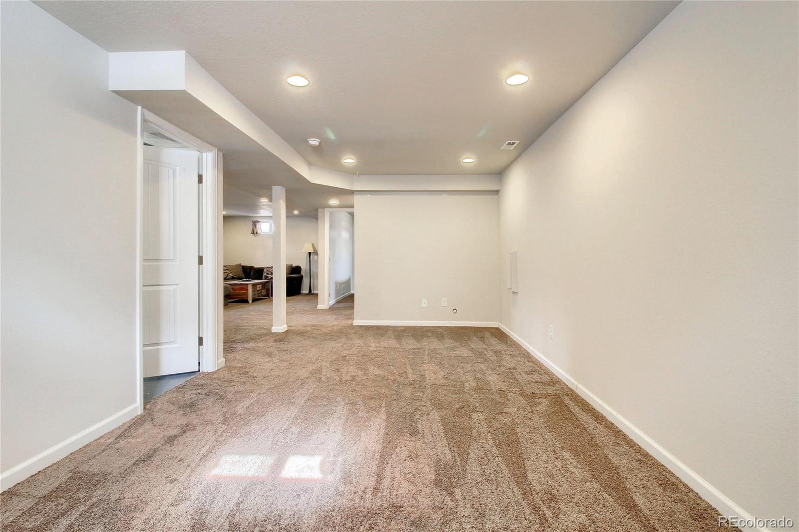 7545 Turner Drive Denver, CO 80221 - Photo 33 of 38 an empty room with a natural light