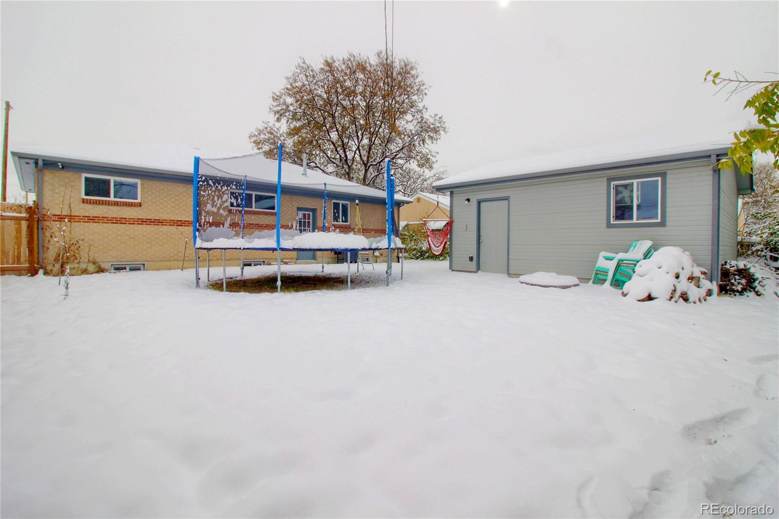 7545 Turner Drive Denver, CO 80221 - Photo 36 of 38 a view of a house with a yard and garage