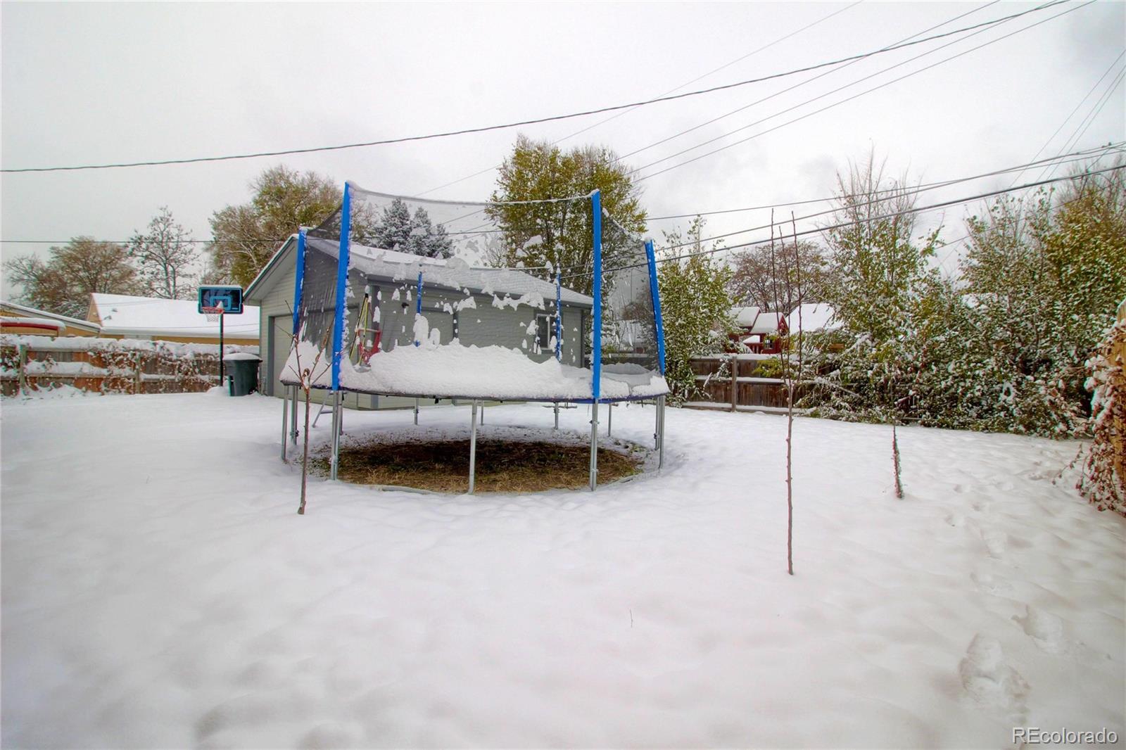 7545 Turner Drive Denver, CO 80221 - Photo 37 of 38 a view of outdoor space with seating area and trees