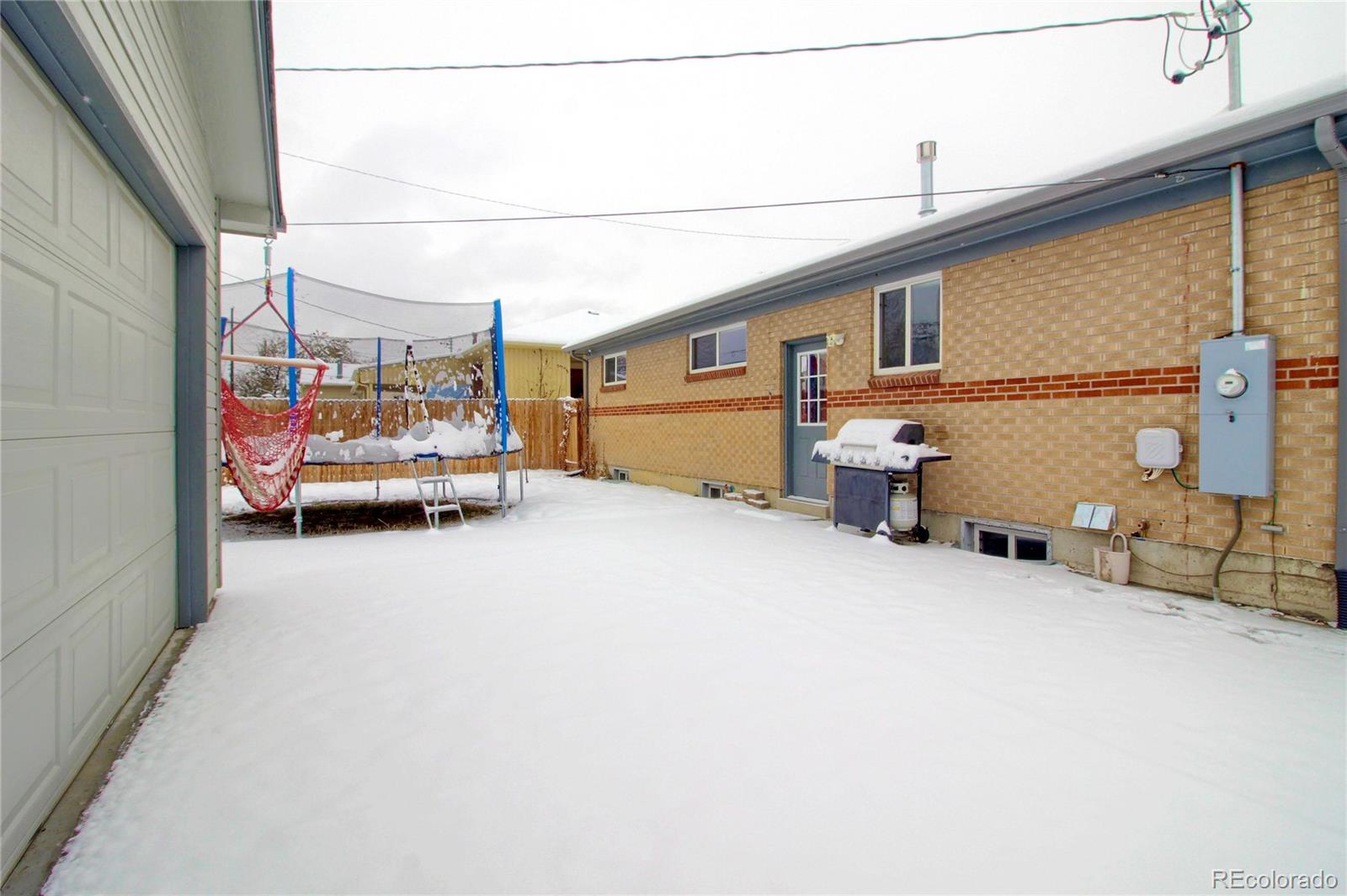 7545 Turner Drive Denver, CO 80221 - Photo 38 of 38 a view of a car park in front view of a house