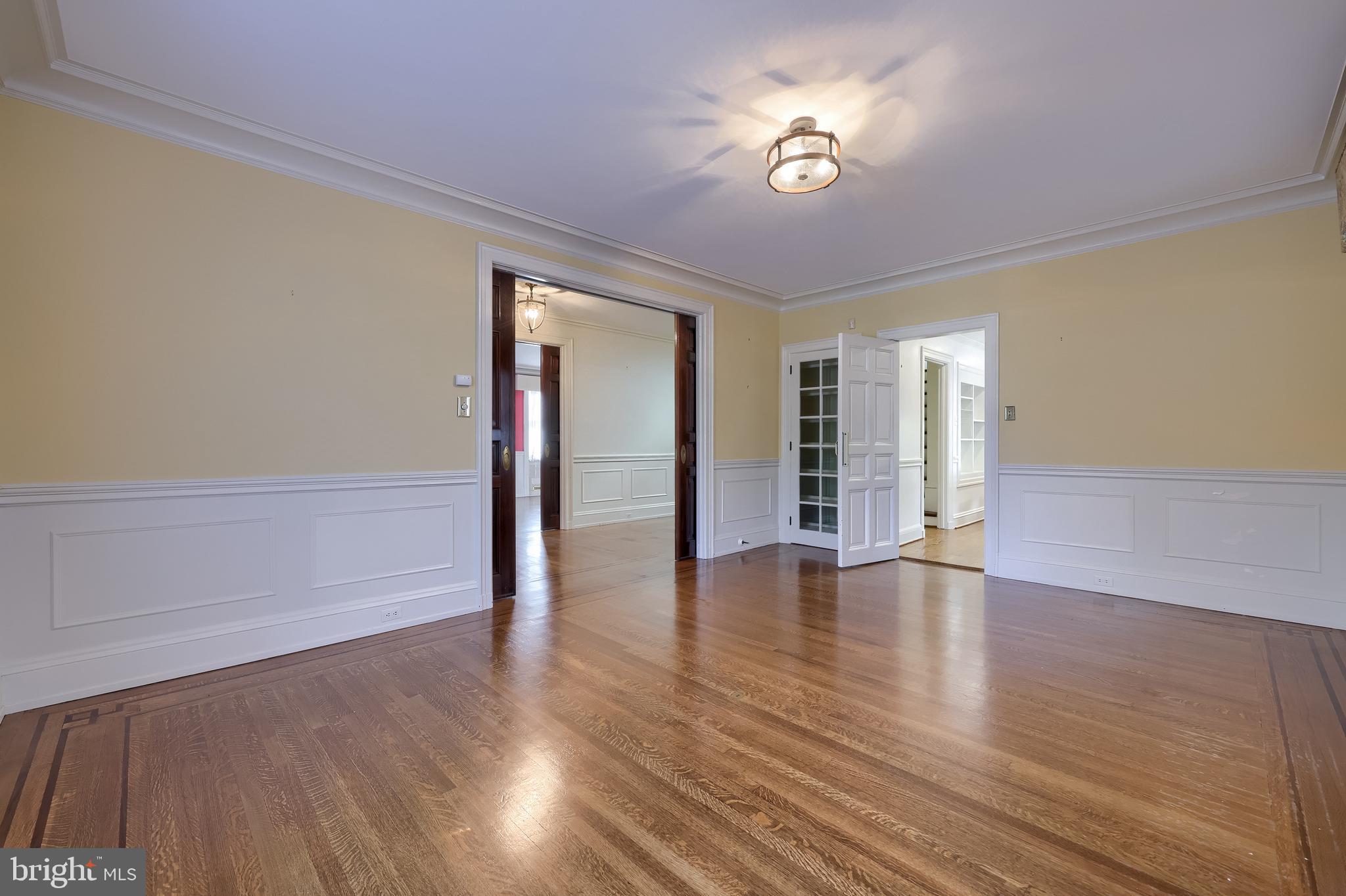 146 East Springettsbury Avenue York, PA 17403 - Photo 13 of 47 a view of an empty room with a window and wooden floor