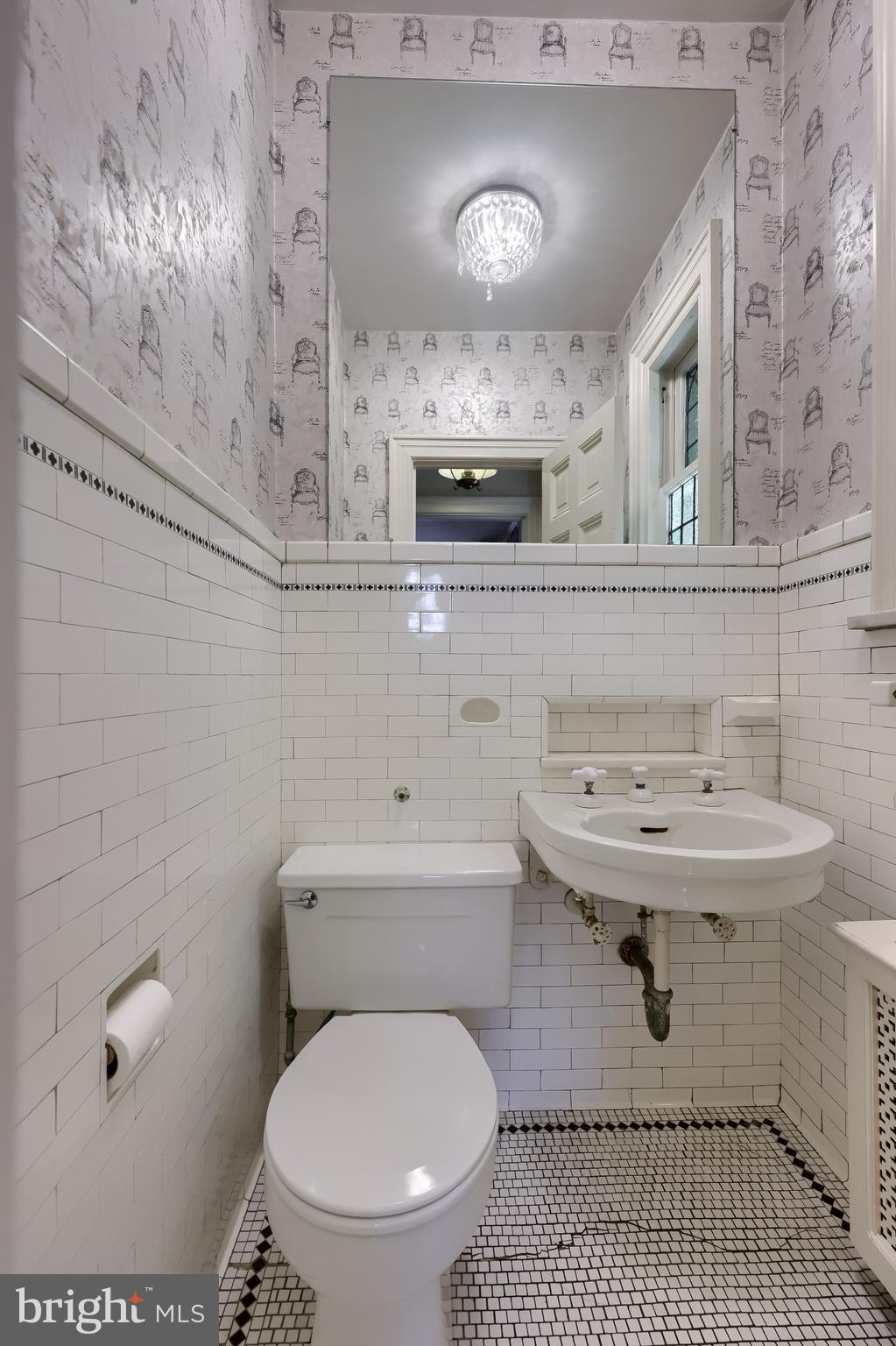 146 East Springettsbury Avenue York, PA 17403 - Photo 18 of 47 a bathroom with a sink a toilet and mirror