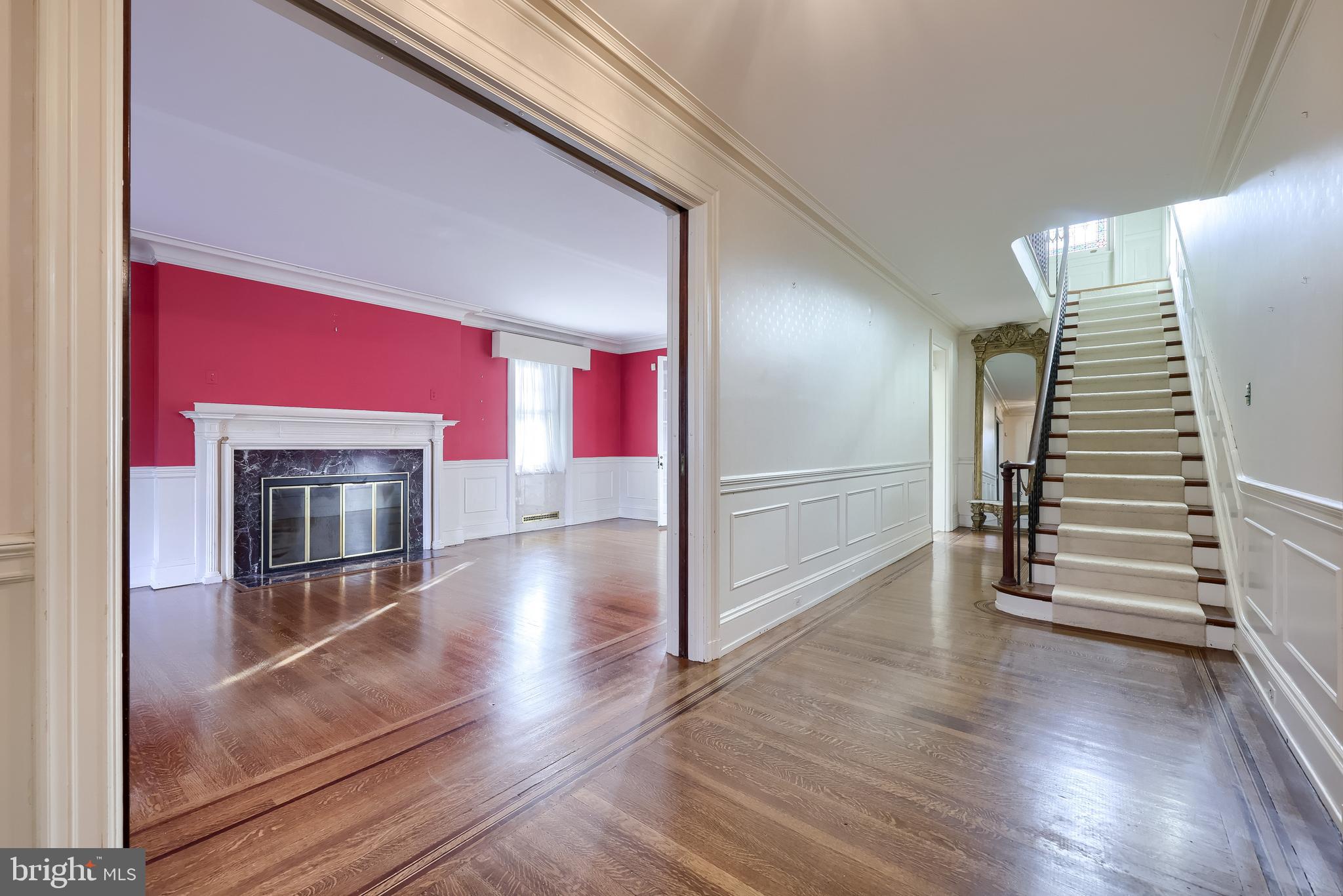 146 East Springettsbury Avenue York, PA 17403 - Photo 2 of 47 a view of a livingroom with wooden floor and staircase