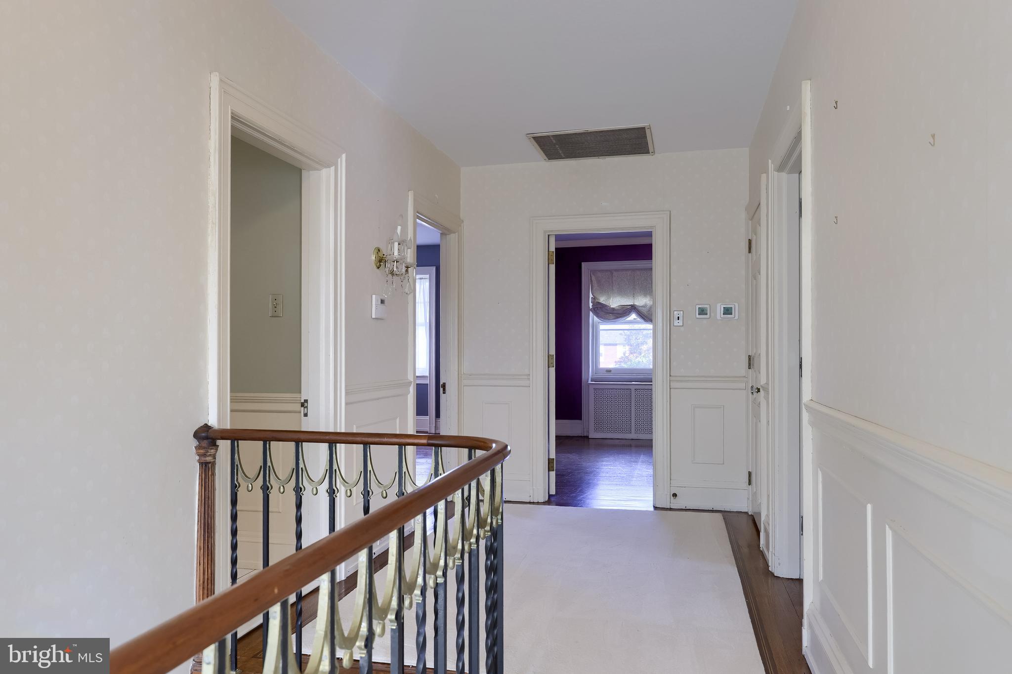 146 East Springettsbury Avenue York, PA 17403 - Photo 23 of 47 a view of a hallway with wooden floor and staircase