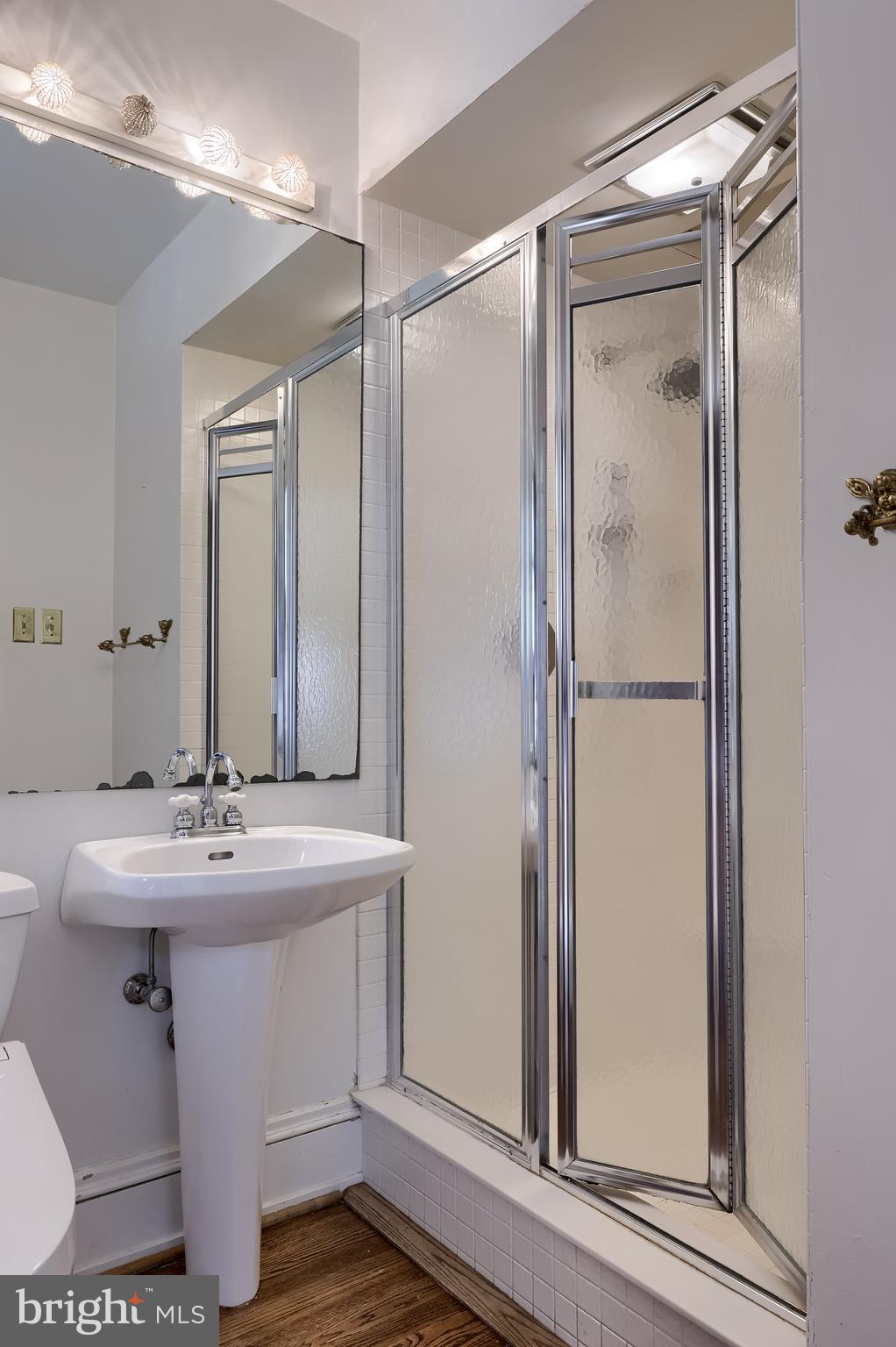 146 East Springettsbury Avenue York, PA 17403 - Photo 32 of 47 a bathroom with a sink mirror and a shower