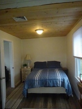 83 Shore Avenue, Unit 83 Wareham, MA 02571 - Photo 14 of 32 a bedroom with a bed and window