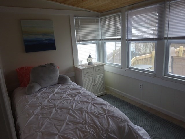 83 Shore Avenue, Unit 83 Wareham, MA 02571 - Photo 15 of 32 a bedroom with a large bed and a window