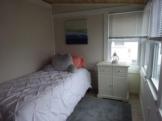 83 Shore Avenue, Unit 83 Wareham, MA 02571 - Photo 16 of 32 a bedroom with a bed and a window