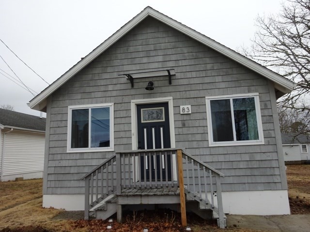 83 Shore Avenue, Unit 83 Wareham, MA 02571 - Photo 2 of 32 a front view of a house with large windows