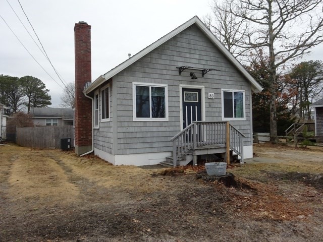 83 Shore Avenue, Unit 83 Wareham, MA 02571 - Photo 3 of 32 a view of a house with a yard and stairs