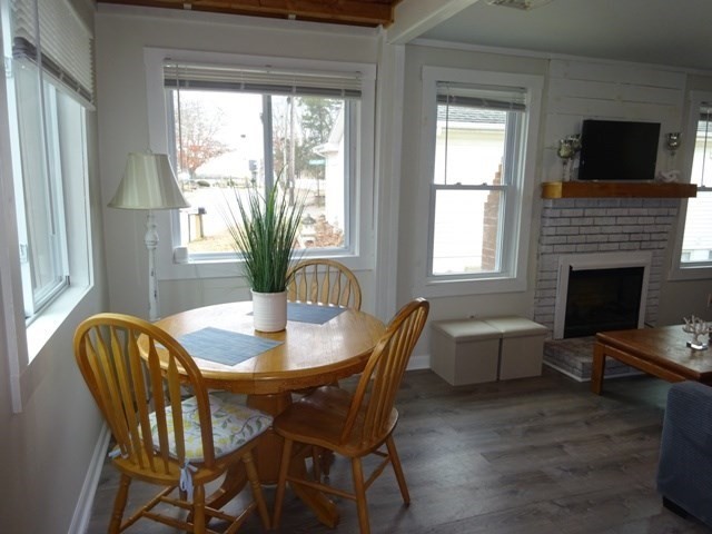 83 Shore Avenue, Unit 83 Wareham, MA 02571 - Photo 4 of 32 a dining room with furniture window and wooden floor
