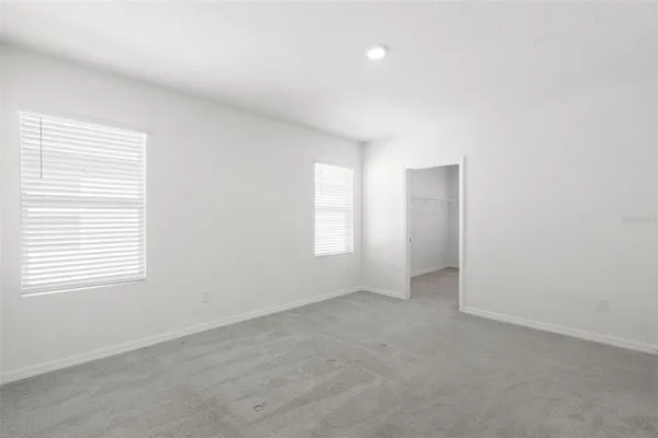 a bathroom with a sink shower and a mirror