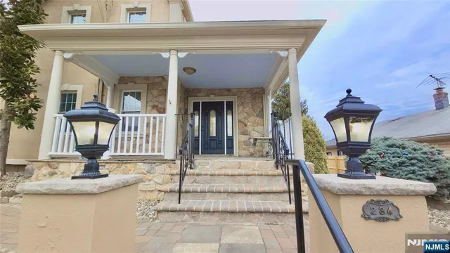 a view of a house with entrance gate