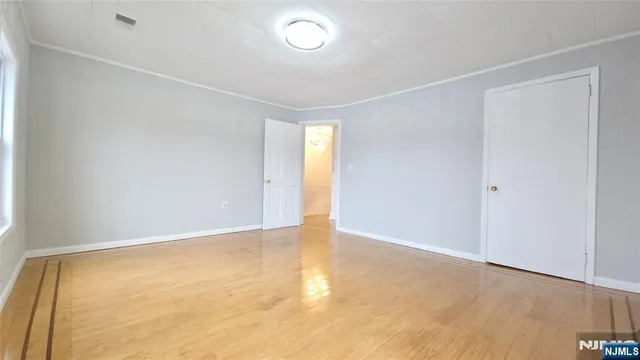 an empty room with a empty space and a window