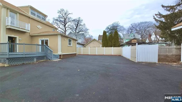 a view of a house with a backyard
