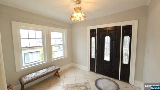 a front view of a house with large windows