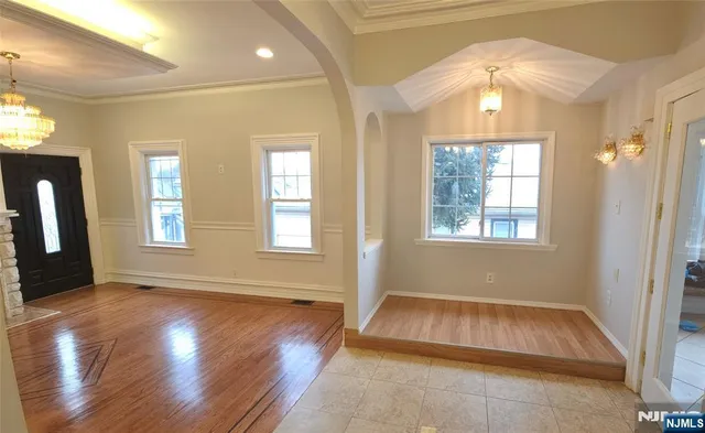 a view of an entryway with wooden floor and a window