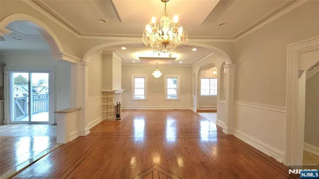 a view of an entryway with wooden floor