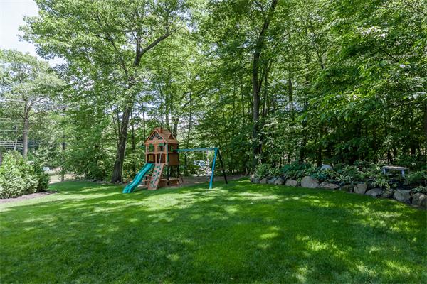 220 Easthampton Road Holyoke, MA 01040 - Photo 8 of 30 a view of a backyard with a slide trees and wooden fence
