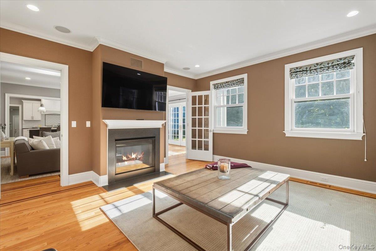 96 Brookby Road Scarsdale, NY 10583 - Photo 13 of 45 Media room with gas fireplace, the perfect place to enjoy a movie