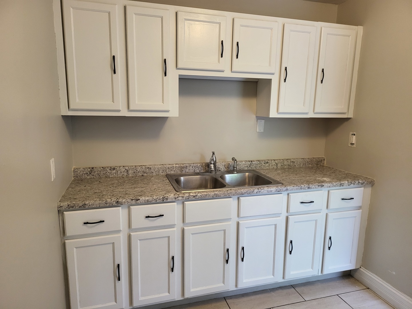 110 Walden Road Joliet, IL 60433 - Photo 17 of 20 a kitchen with white cabinets and white appliances