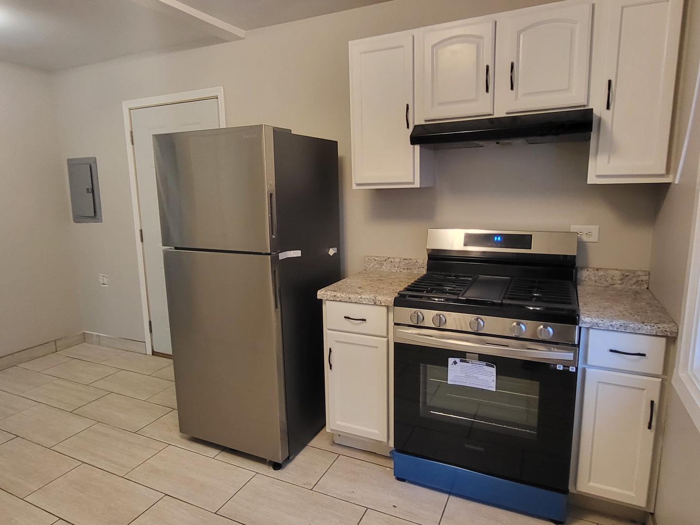 110 Walden Road Joliet, IL 60433 - Photo 18 of 20 a kitchen with cabinets and stainless steel appliances