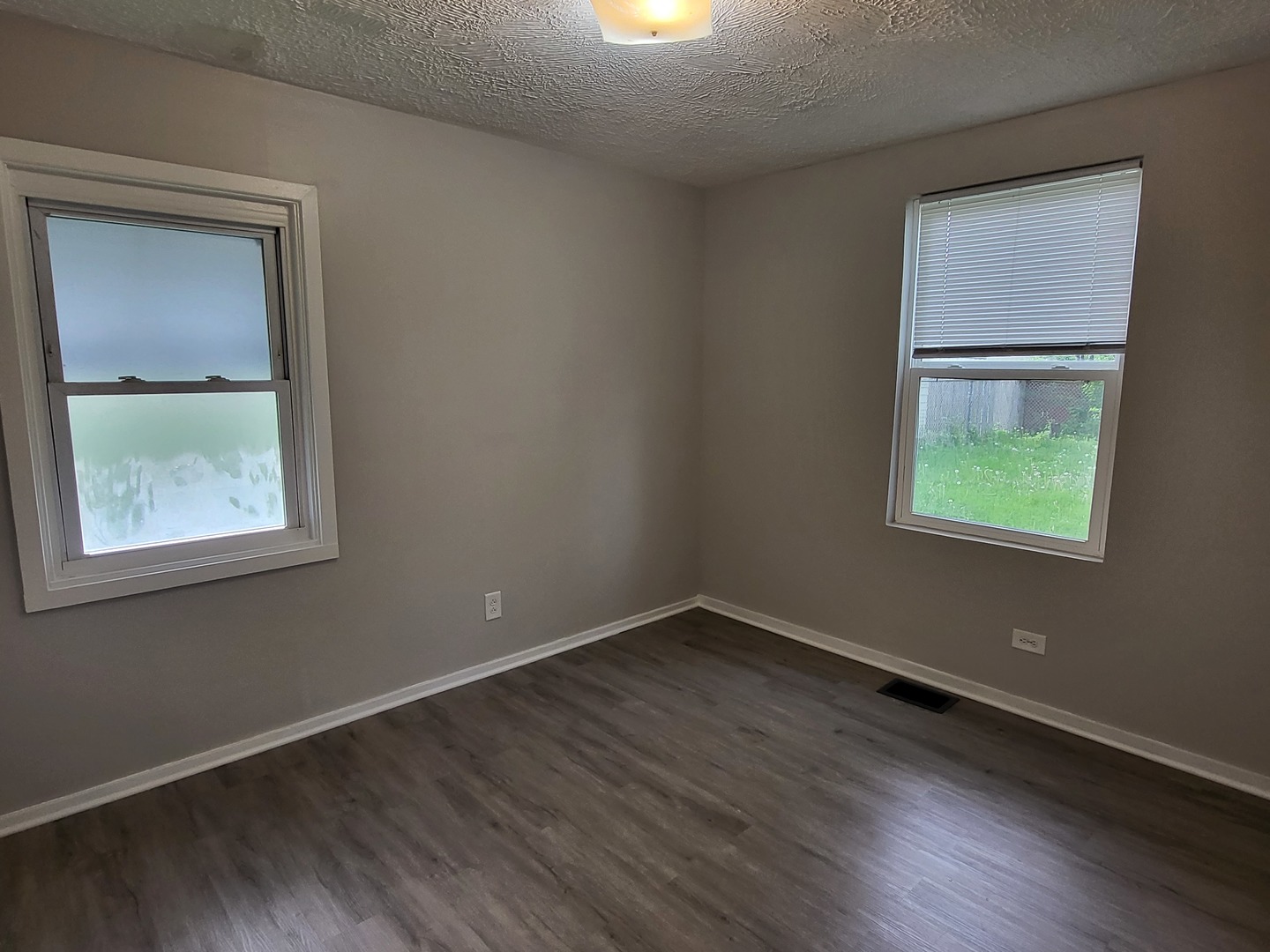 110 Walden Road Joliet, IL 60433 - Photo 7 of 20 an empty room with a window